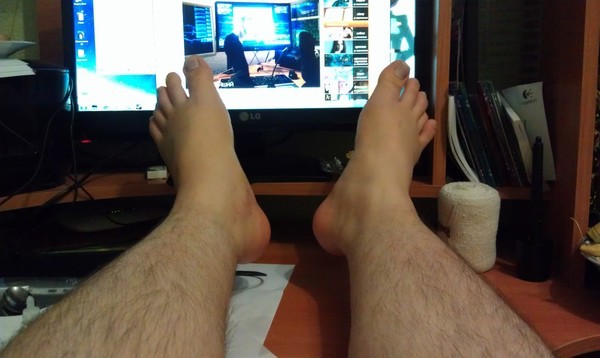 Create meme: leg cast, men's legs, feet on the table