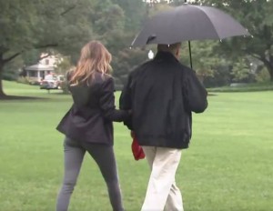 Create meme: melania trump, umbrella, Hannah goes with protection
