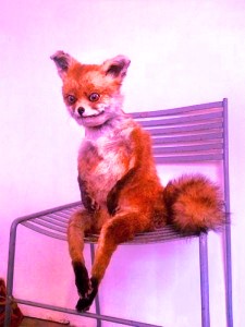 Create meme: a stuffed Fox , stoned Fox , a fox on a chair