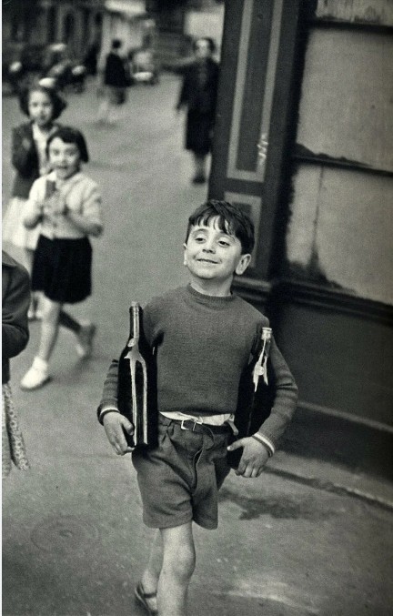 Create meme: Henri Cartier-Bresson boy with Wine, Henri Cartier Bresson boy with bottles, Henri Cartier-bresson