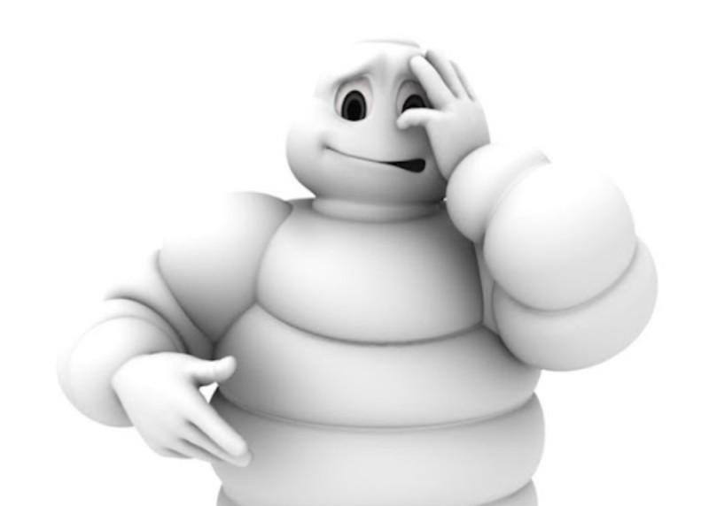 Create meme: bibendum michelin, michelin mascot tires, red michelin guide