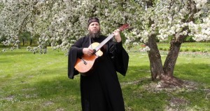 Создать мем: гитара, православный, монах киприан