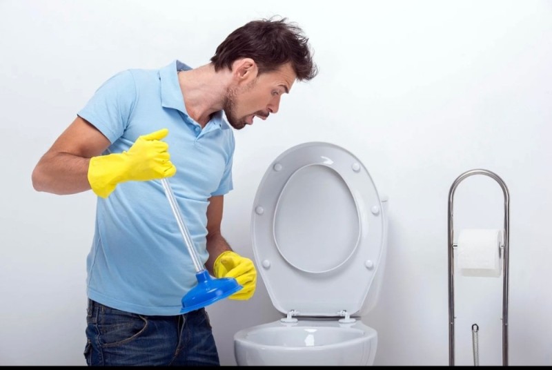 Create meme: toilet blockage, a man cleans the toilet, cleaning the toilet