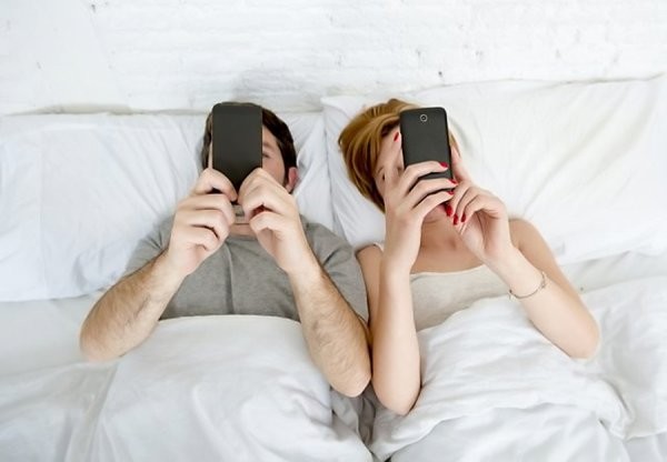 Create meme: husband and wife on the phones, In bed with a phone, the sex in a relationship