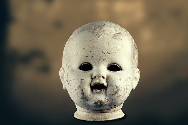 Create meme: scary doll head, scary stories , dark fire