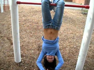 Создать мем: hanging, upside down, Hanging Upside Down Girl