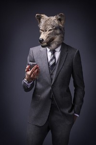 Create meme: grey wolf, the man with the head of a wolf, wolf in a suit