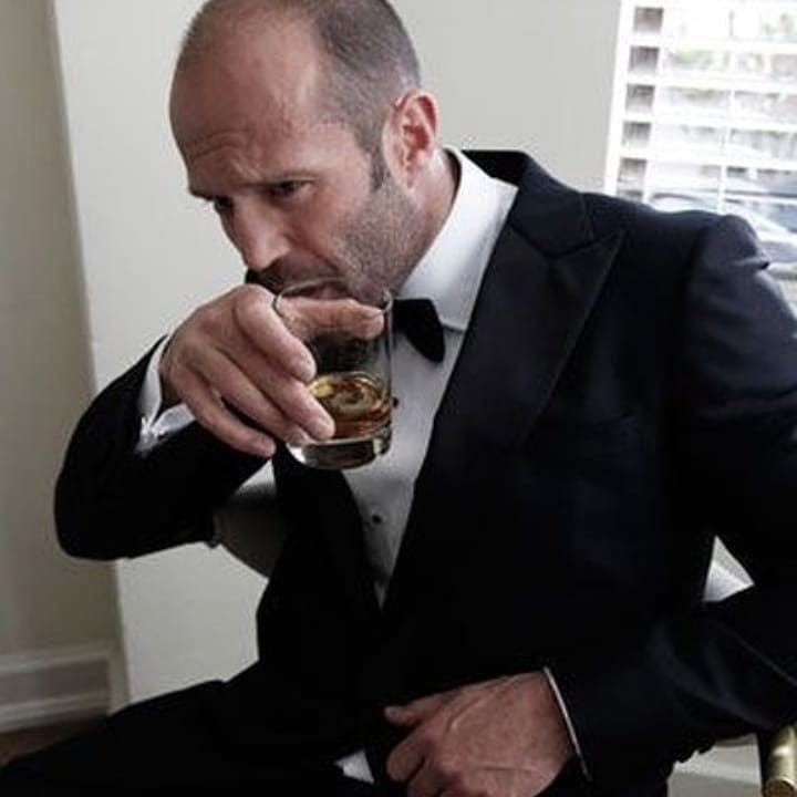 Create meme: Jason Statham , Jason Statham with a glass, meme Jason Statham