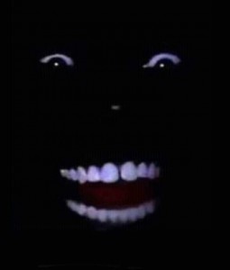 Create meme: darkness, ebony smiles in the dark, Negro laughing in the dark