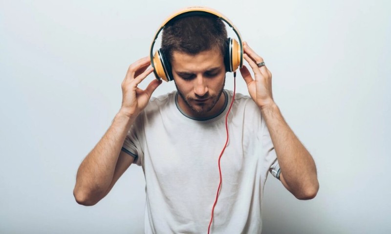 Create meme: a man with headphones, the man in the earphones, play music listen to music