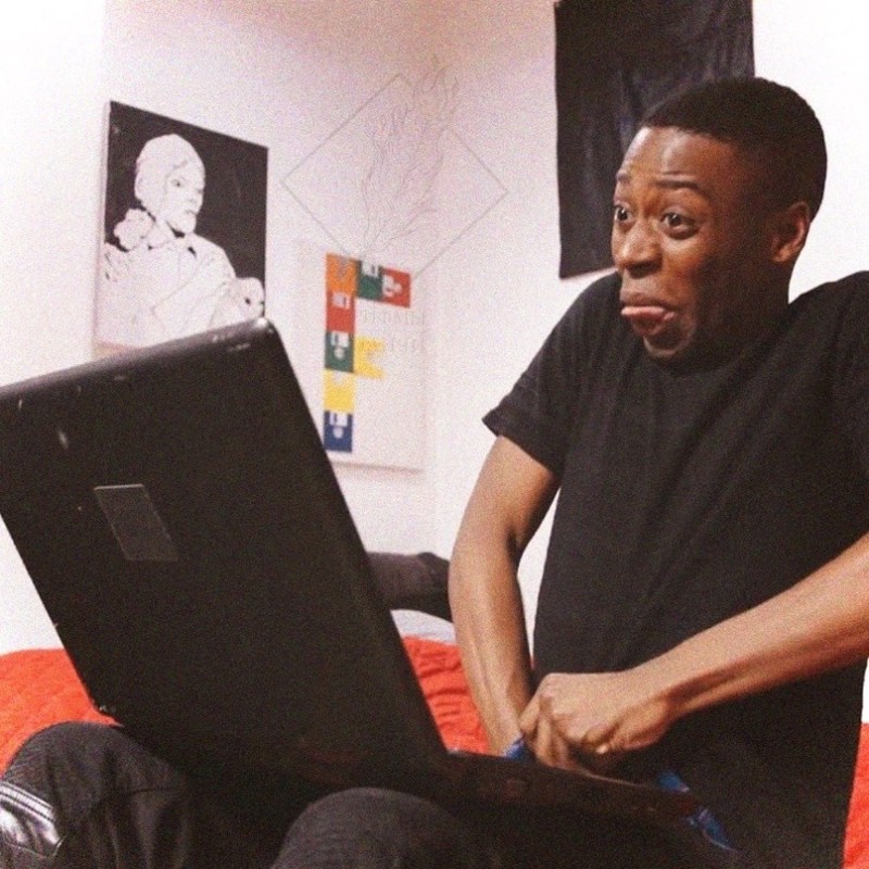 Create meme: black man with hand in pants, meme black man with hand in pants, Negro with a laptop