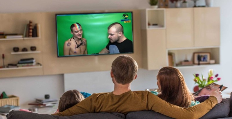 Create meme: TV , family watching TV, the family behind the TV