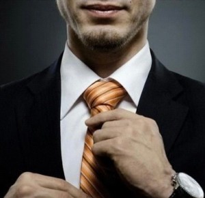 Создать мем: поправляет галстук, галстук, успешный мужчина с галстуком радуется