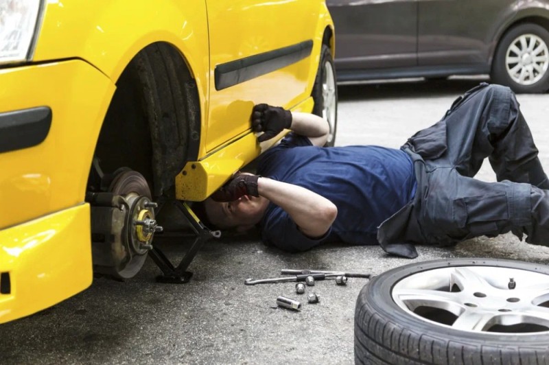 Create meme: The man under the car, crushed by a car, auto repair