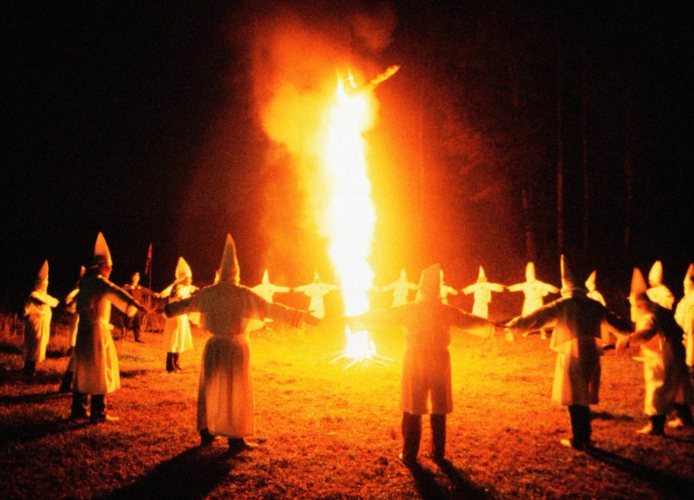 Create meme: the ku Klux Klan , The burning cross of the Ku klux Klan, The Kuklus clan by the campfire
